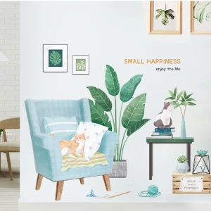 Mèo vàng trên sofa và chậu cây