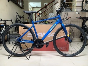 Xe đạp thể thao touring TRINX (THẮNG ĐĨA CƠ), Group Shimano 21 tốc độ. Hàng nhập khẩu nguyên chiếc, mới 100%. Màu Xanh